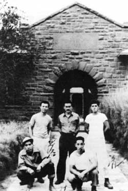 Japanese men standing in front of a building at the old Leupp Boarding School turned Isolation Center.