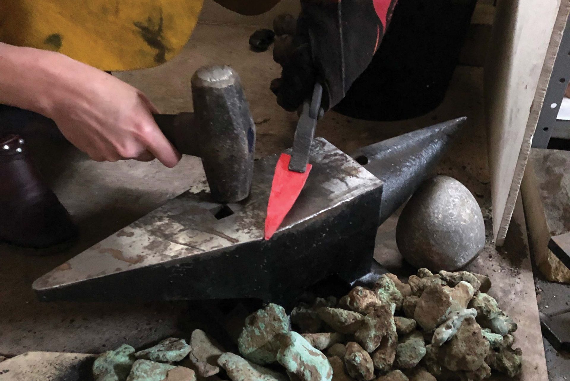 Copper native to the Upper Peninsula of Michigan becomes brittle with repeated hammering, so heating the materials and shaping them—known as annealing—is an essential component of copper tool production. Here, Bebber shapes annealed copper into a point. Photo: Bob Christy / Courtesy of Kent State University