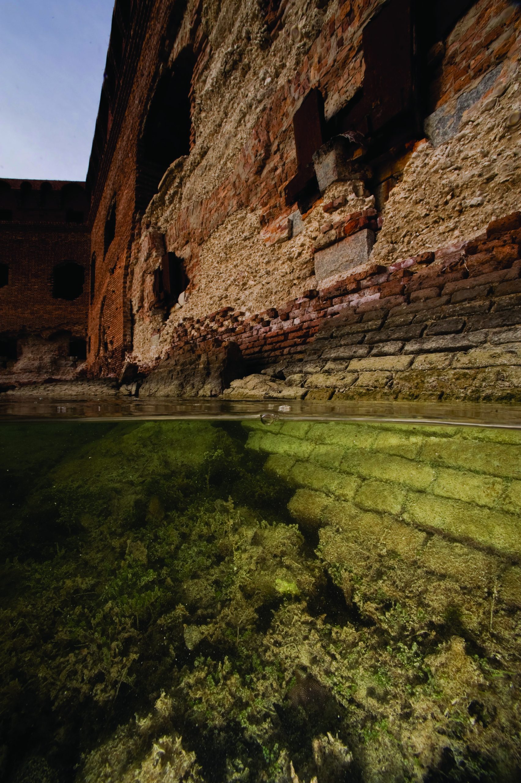 photo showing ancient ruins being encroached by rising water levels.
