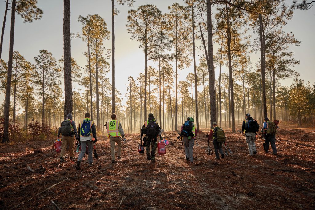 Metal detectors in hand, veterans participating in the American Veterans Archaeological Recovery program (AVAR) walk to the section of the Camden battlefield designated for survey. Photo by Chris M. Rogers / American Battlefield Trust
