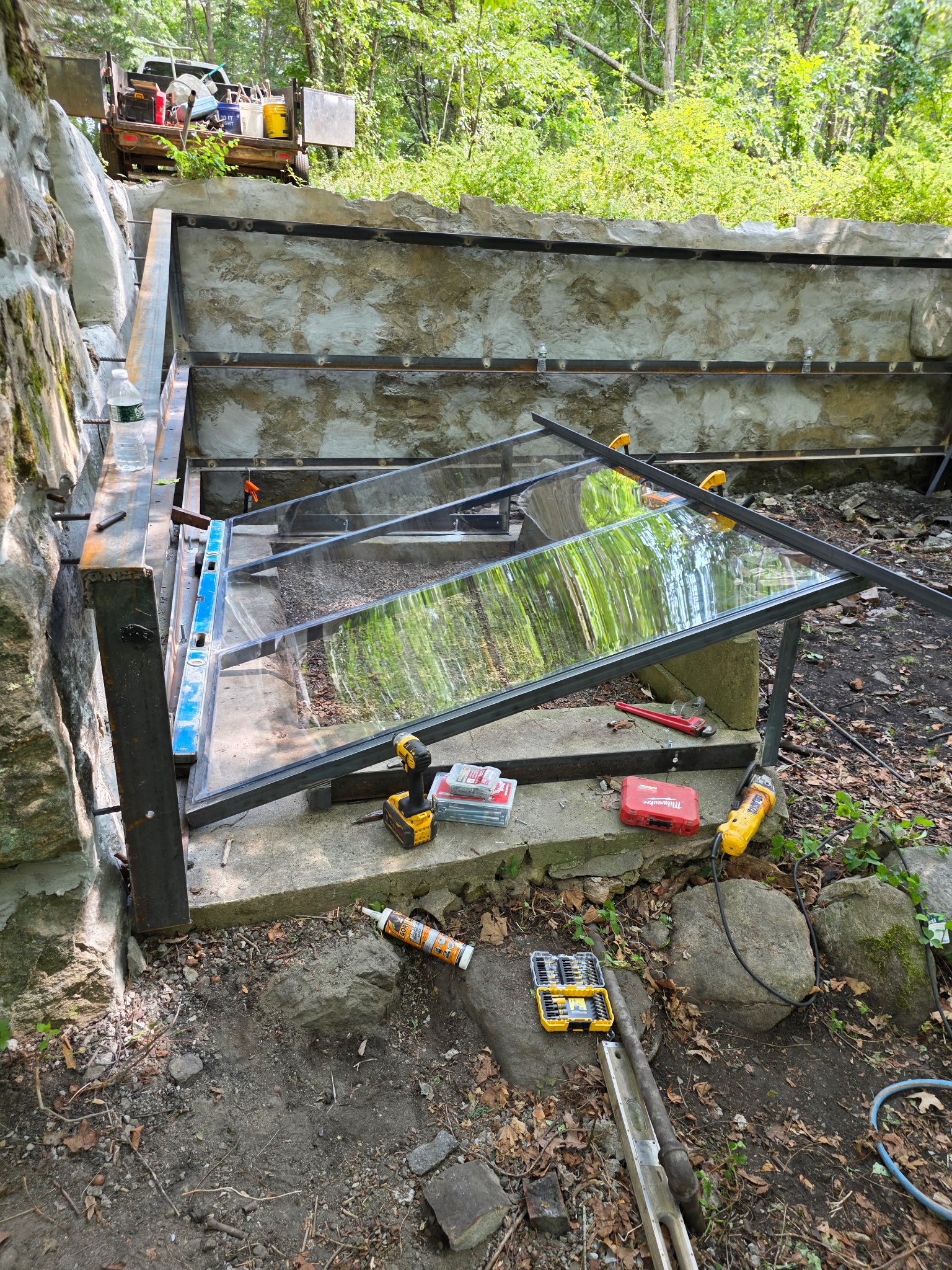 A new cover on the mikveh and steel bracing along the walls will protect the foundation into the future. Photo by Derek Pepin.