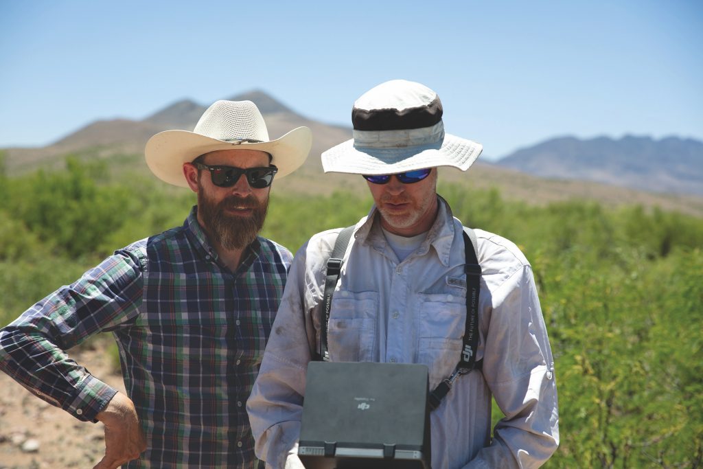 Dr. Michael Searcy, left, and Dr. Scott Ure watch live drone footage from the Gateway X100 UAS (below) flown over Paquimé and San Diego sites in 2015. Photos courtesy of Dr. Scott Ure.